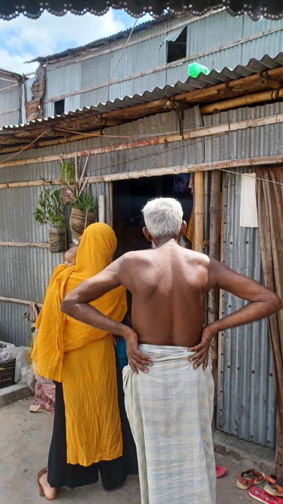 Some residents peak into a neighbour’s room to watch TV.