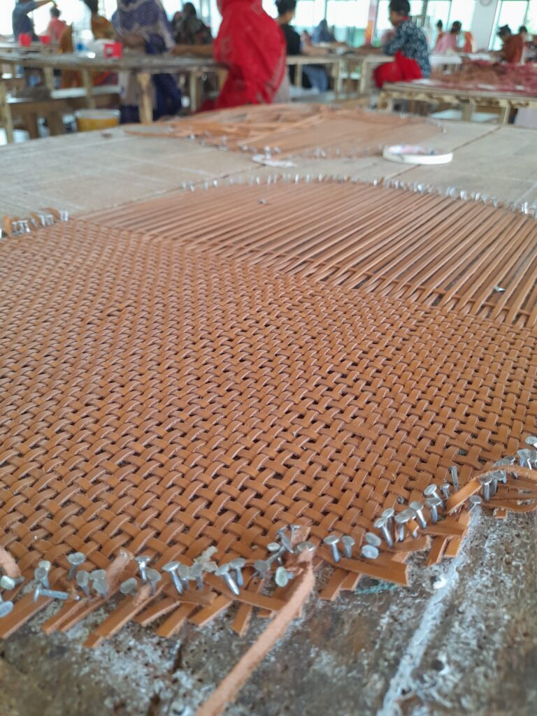 Leather being woven into bags