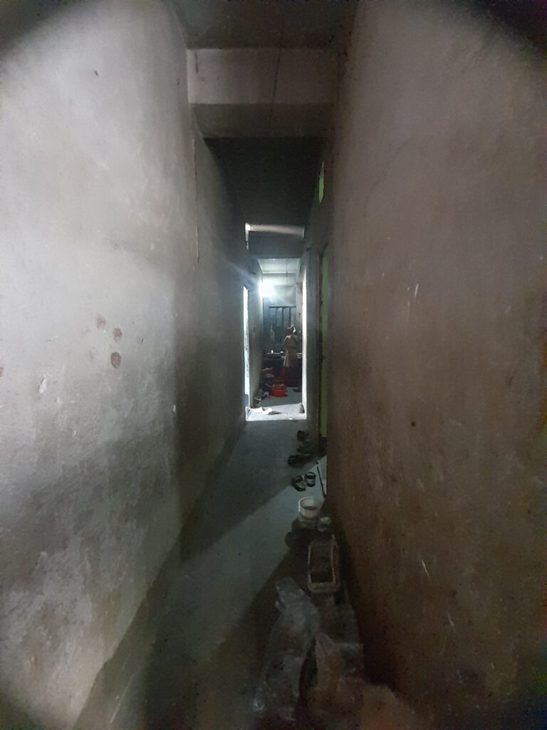 The corridor leading to Sonju’s home (in a large building split into many small units)