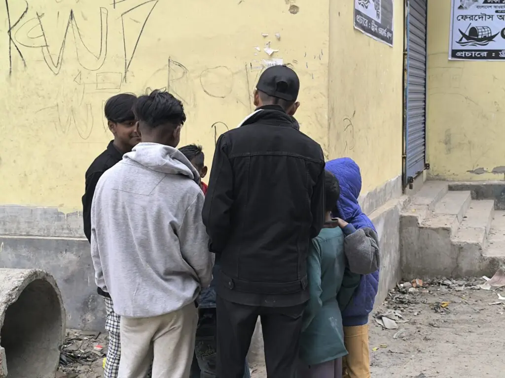 Group of teenage boys in huddle chatting