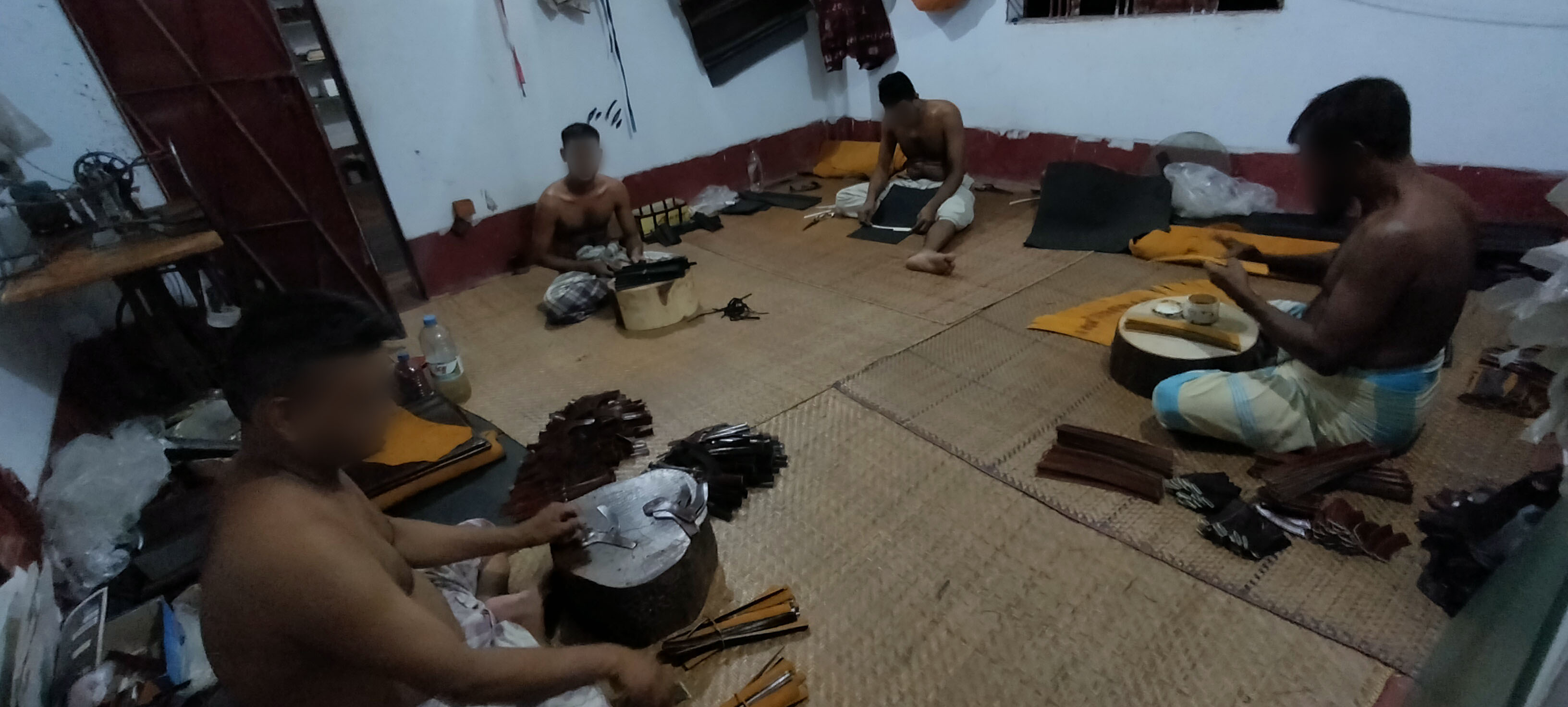 Workers making different parts of shoes